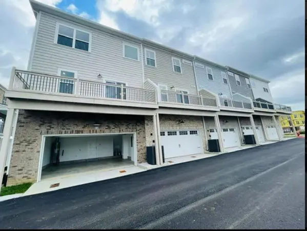 a large white building with a balcony