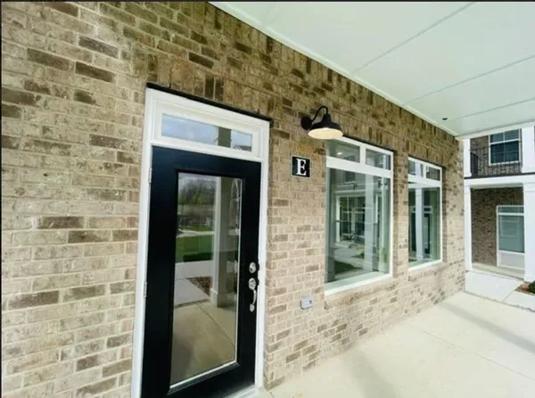 a view of a brick house with front door