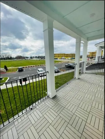 a view of balcony with furniture