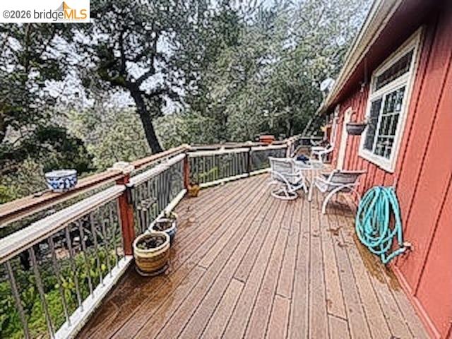 552 Bean Creek Road, Unit SPC 94 Scotts Valley, CA 95066 - Photo 13 of 23 a balcony with wooden floor stairs and wooden fence