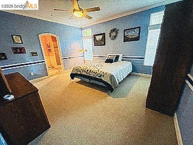 552 Bean Creek Road, Unit SPC 94 Scotts Valley, CA 95066 - Photo 8 of 23 a spacious bedroom with a bed and painting on the wall