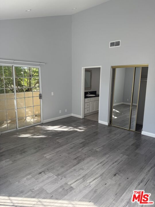 7639 Kester Avenue, Unit 1 Van Nuys, CA 91405 - Photo 9 of 21 a view of a livingroom with wooden floor