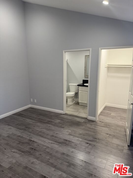 7639 Kester Avenue, Unit 1 Van Nuys, CA 91405 - Photo 10 of 21 a view of a room with a wooden floor