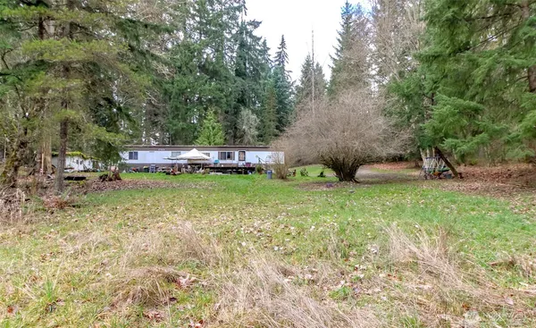 a view of a backyard with swimming pool