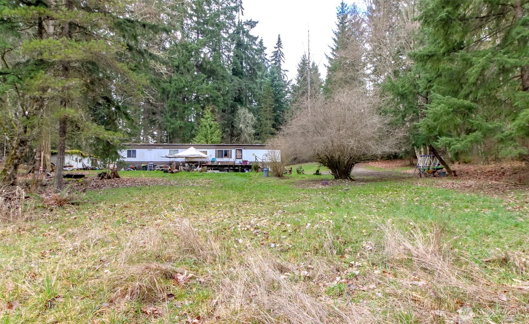 7308 335th St Court South Roy, WA 98580 - Photo 6 of 21 a view of a backyard with swimming pool