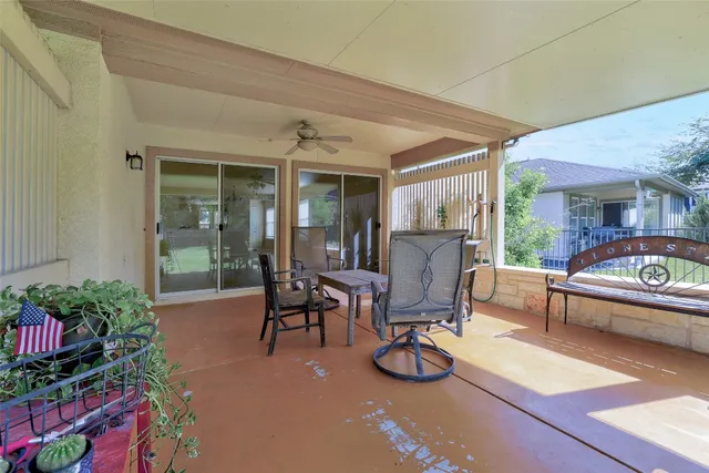 a view of a house with patio outdoor seating