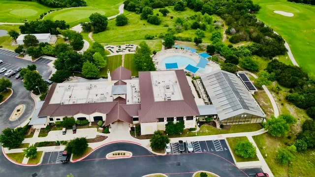 an aerial view of a house with yard swimming pool and outdoor seating