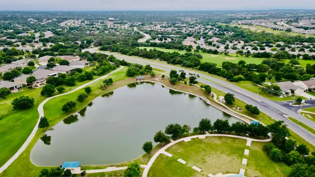 an aerial view of a house with a swimming pool yard and outdoor seating