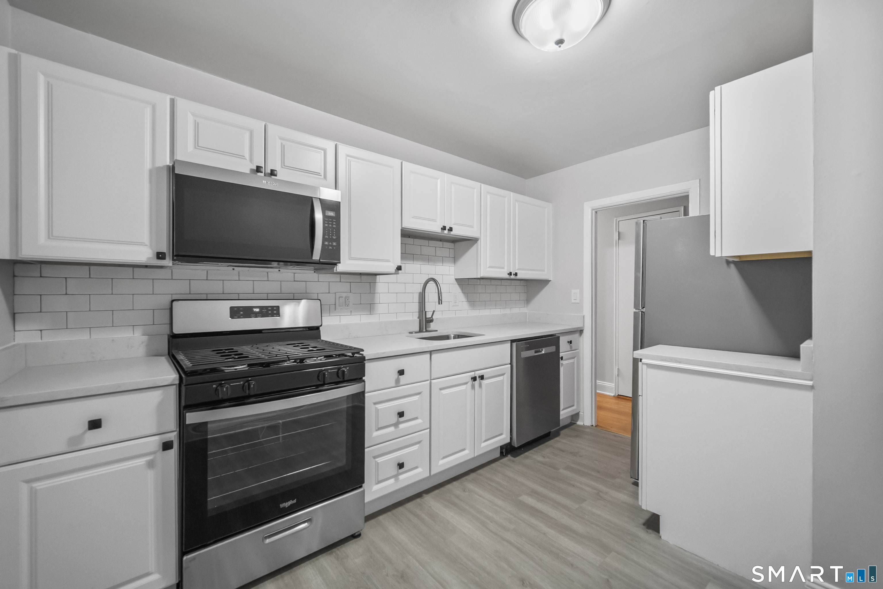 Photos are of another unit that is a mirror image of this layout. Finishes may vary.