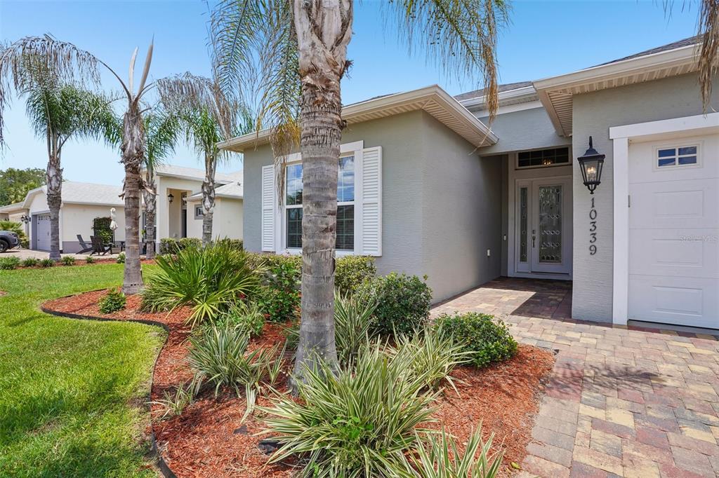 10339 Addison Shore Way Oxford, FL 34484 - Photo 24 of 54 a front view of a house with a yard