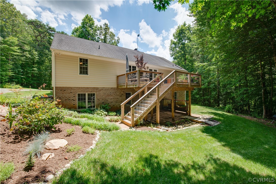 3940 Whitehall Road Sandy Hook, VA 23153 - Photo 12 of 49 a view of a house with a backyard