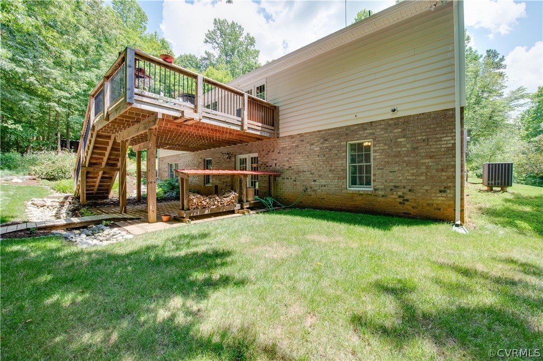 3940 Whitehall Road Sandy Hook, VA 23153 - Photo 14 of 49 a view of a house with backyard and sitting area