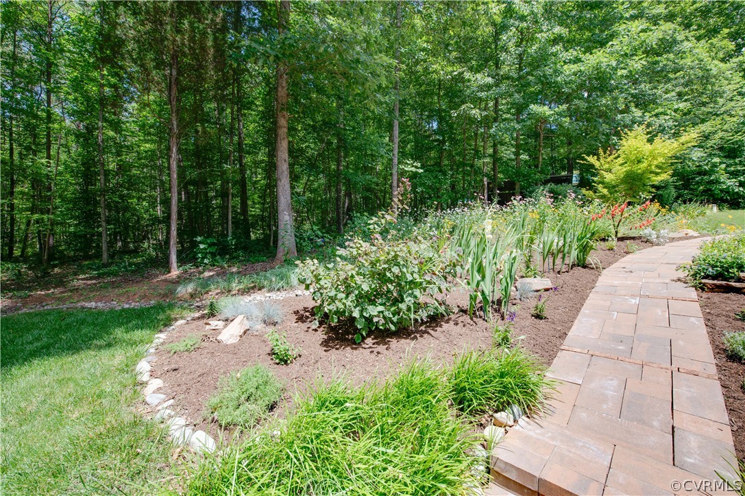 3940 Whitehall Road Sandy Hook, VA 23153 - Photo 19 of 49 a view of a pathway both side of white house