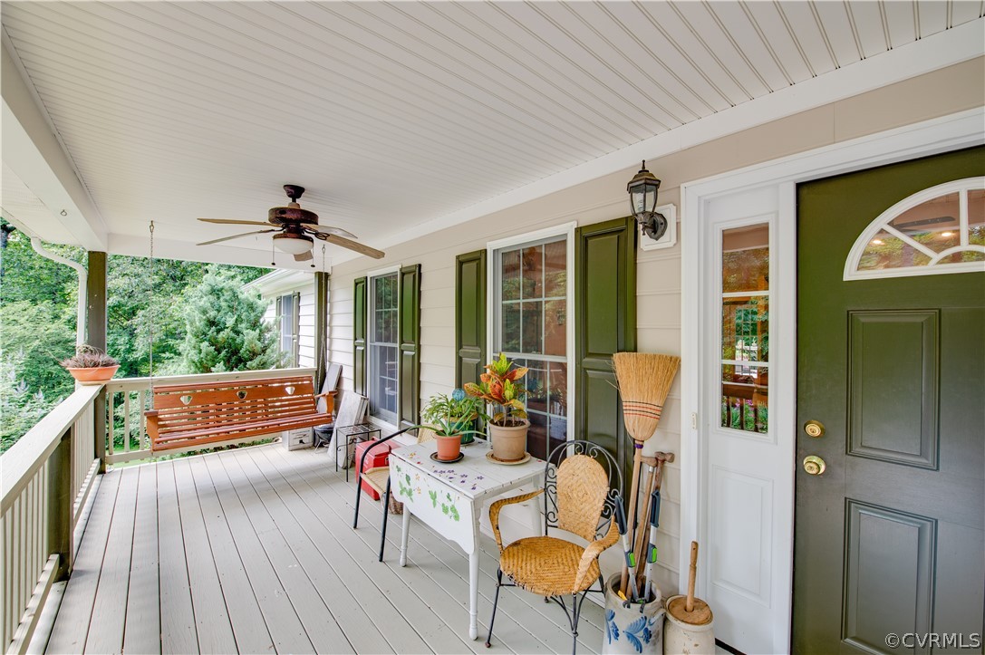 3940 Whitehall Road Sandy Hook, VA 23153 - Photo 20 of 49 a balcony with furniture and wooden floor