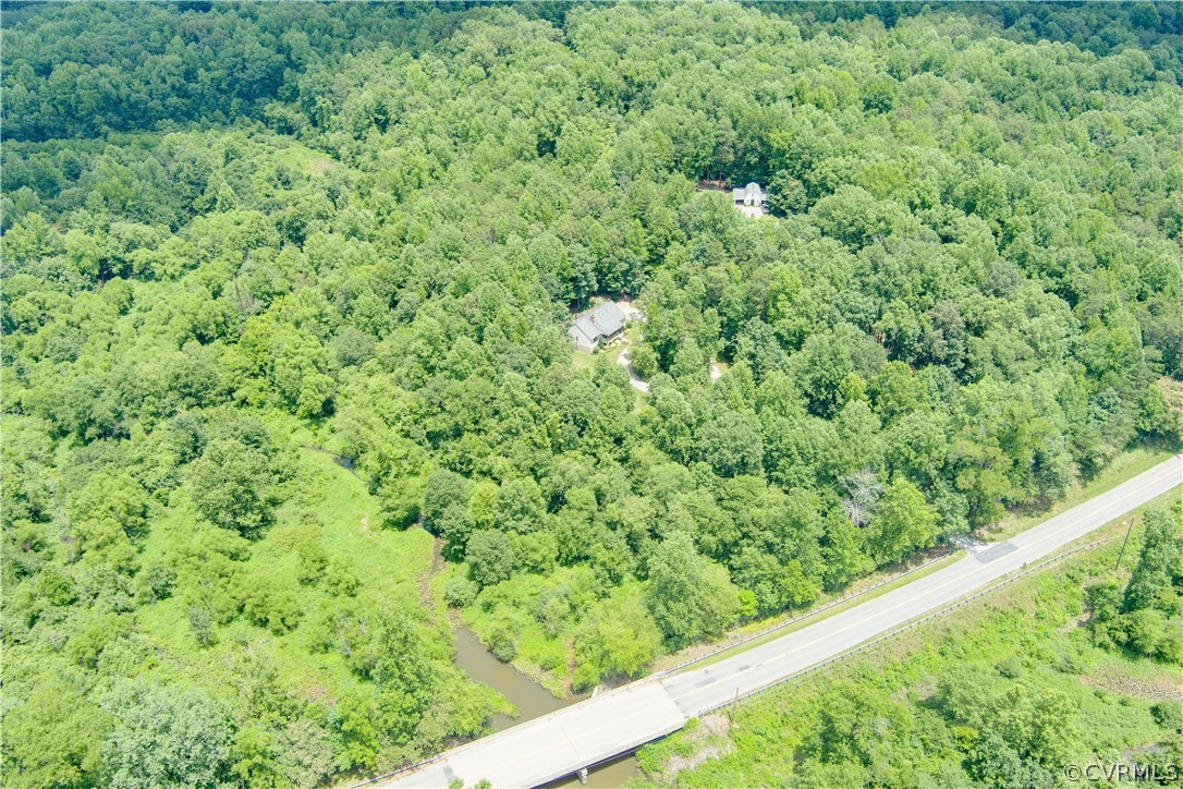3940 Whitehall Road Sandy Hook, VA 23153 - Photo 2 of 49 a view of a green field with lots of bushes