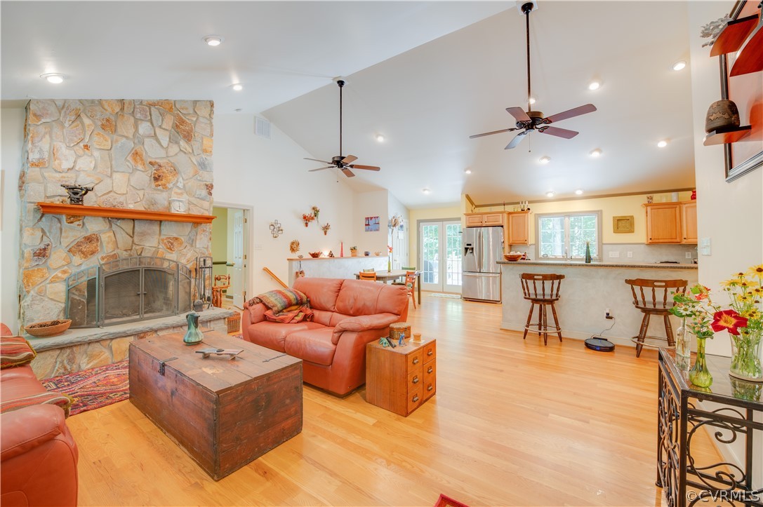 3940 Whitehall Road Sandy Hook, VA 23153 - Photo 22 of 49 a living room with furniture a fireplace and a flat screen tv