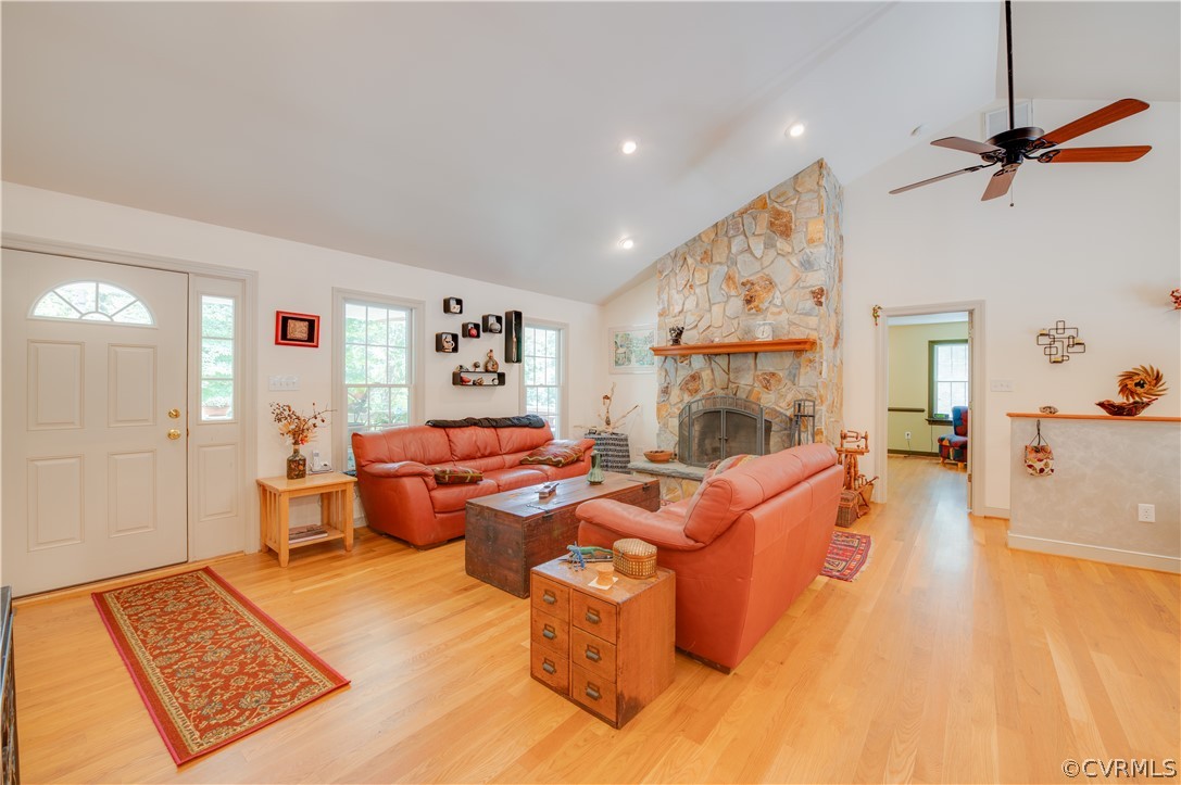 3940 Whitehall Road Sandy Hook, VA 23153 - Photo 23 of 49 a living room with furniture and a fireplace