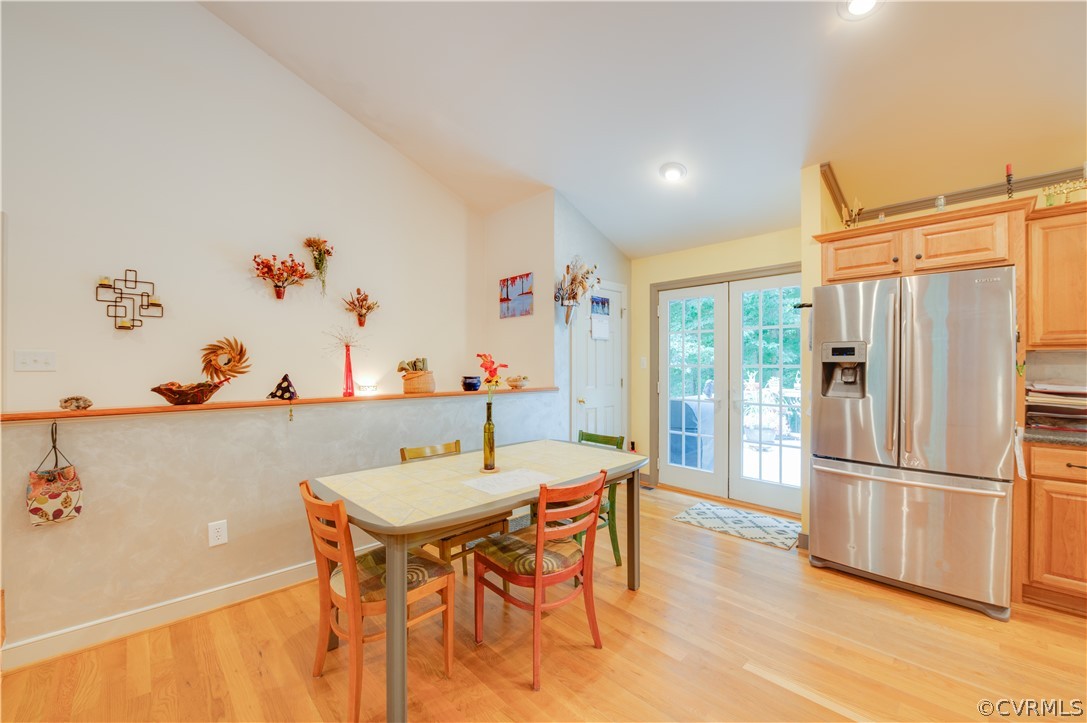 3940 Whitehall Road Sandy Hook, VA 23153 - Photo 26 of 49 a view of a dining room with furniture wooden floor and a refrigerator