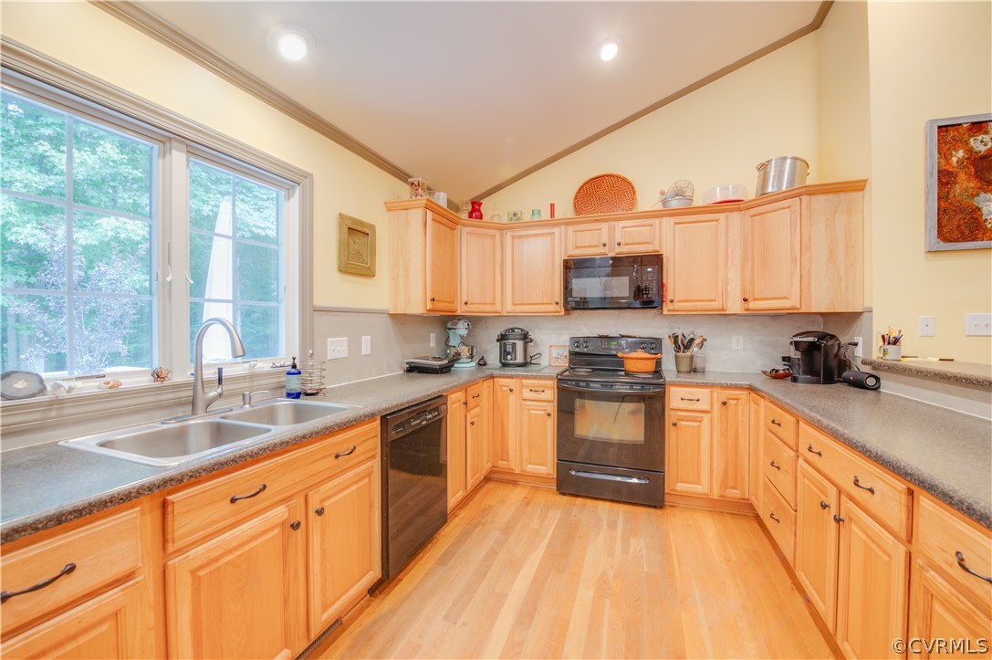 3940 Whitehall Road Sandy Hook, VA 23153 - Photo 27 of 49 a large kitchen with stainless steel appliances granite countertop a stove a sink dishwasher and a microwave oven with cabinets