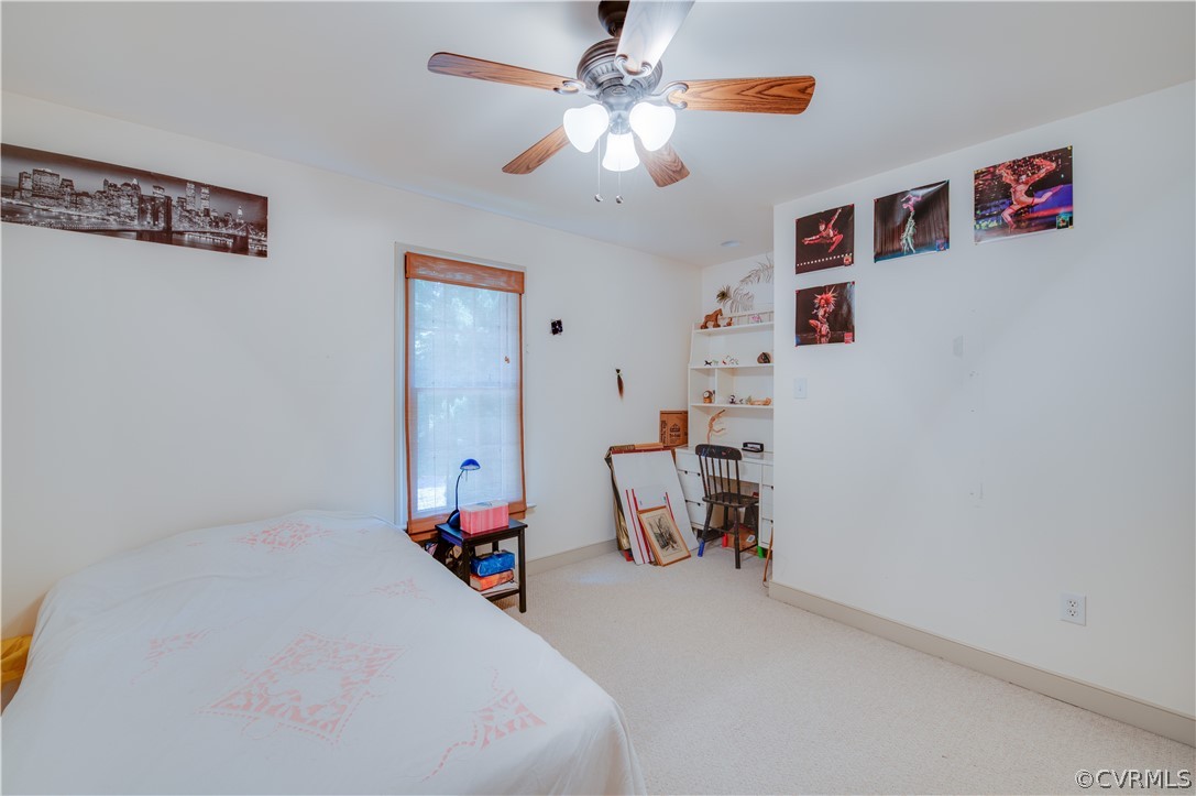 3940 Whitehall Road Sandy Hook, VA 23153 - Photo 32 of 49 a bedroom with furniture and a chandelier