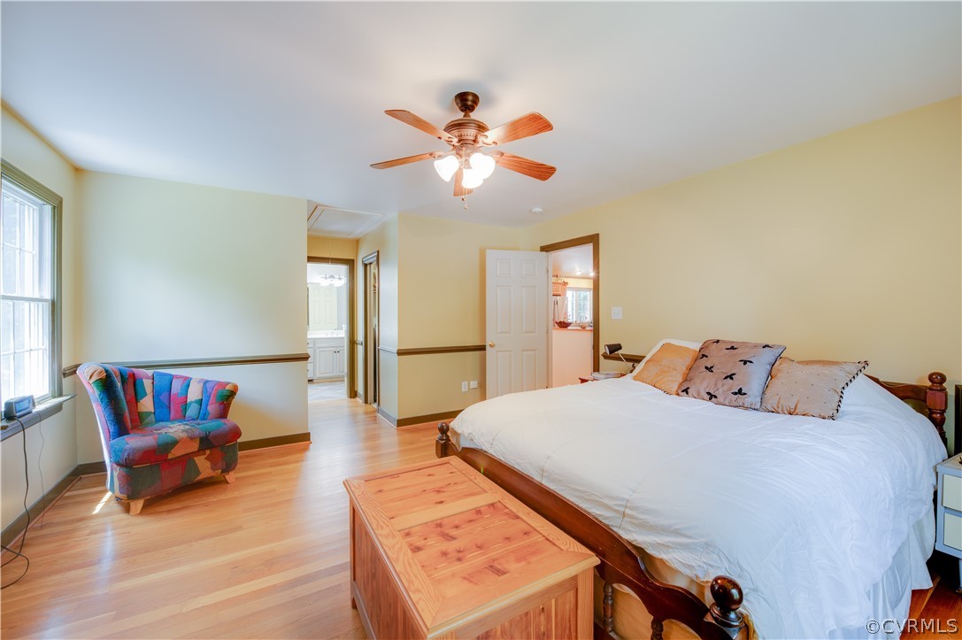 3940 Whitehall Road Sandy Hook, VA 23153 - Photo 35 of 49 a bedroom with a bed and wooden floor