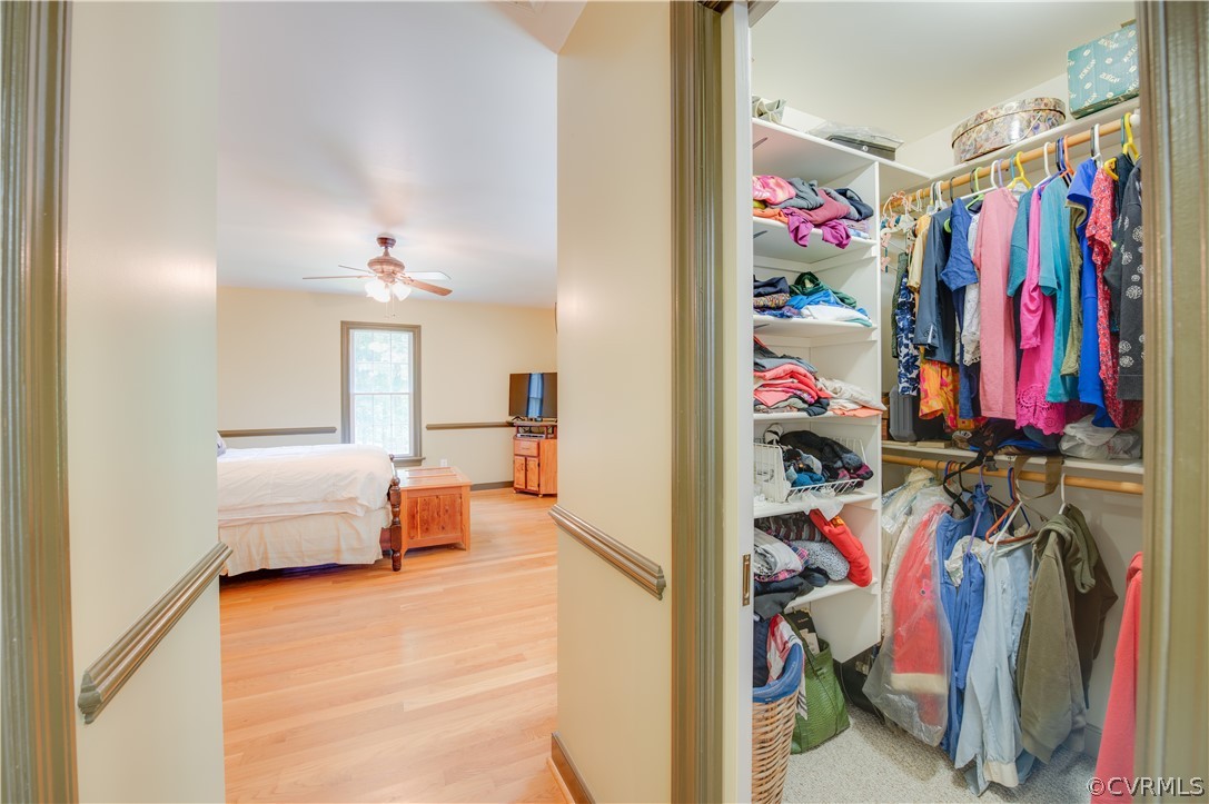 3940 Whitehall Road Sandy Hook, VA 23153 - Photo 37 of 49 a view of walk in closet with clothes and shoes