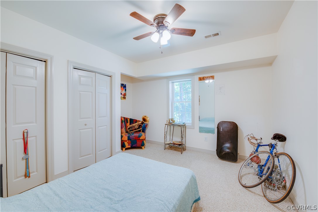 3940 Whitehall Road Sandy Hook, VA 23153 - Photo 45 of 49 a bedroom with furniture and a bicycle