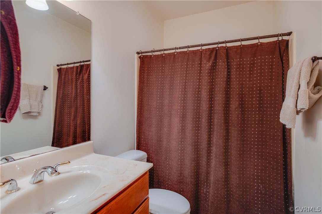 3940 Whitehall Road Sandy Hook, VA 23153 - Photo 46 of 49 a bathroom with a sink and a mirror