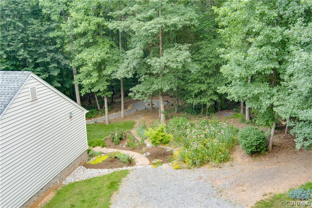 3940 Whitehall Road Sandy Hook, VA 23153 - Photo 5 of 49 a view of a backyard with plants and a lake view