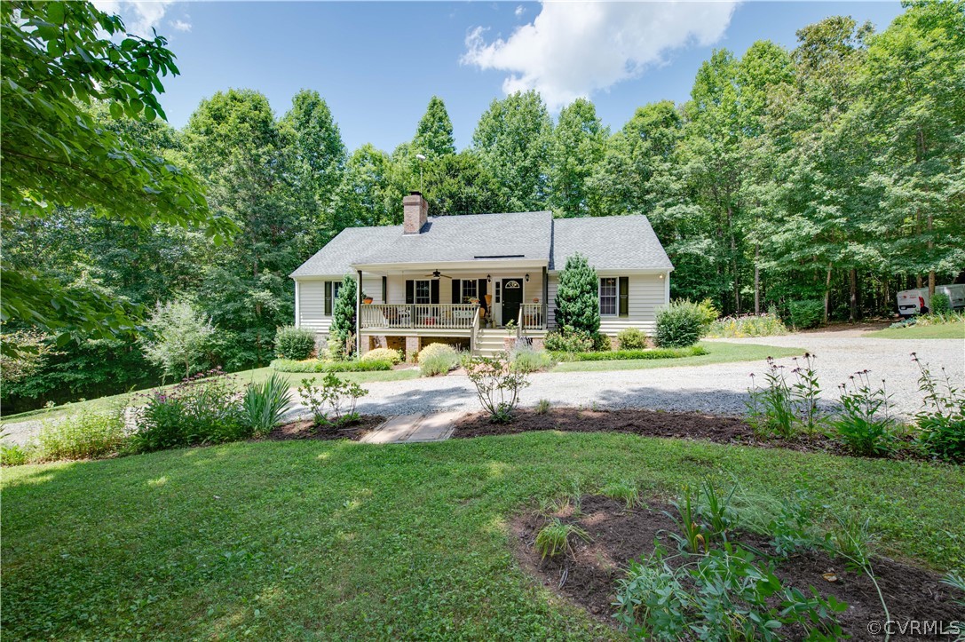 3940 Whitehall Road Sandy Hook, VA 23153 - Photo 10 of 49 a view of a house with a big yard plants and large trees