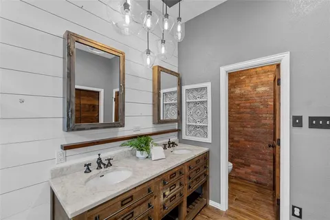 a bathroom with a sink double vanity and a mirror