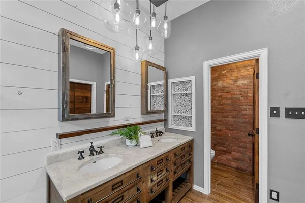 a bathroom with a sink double vanity and a mirror