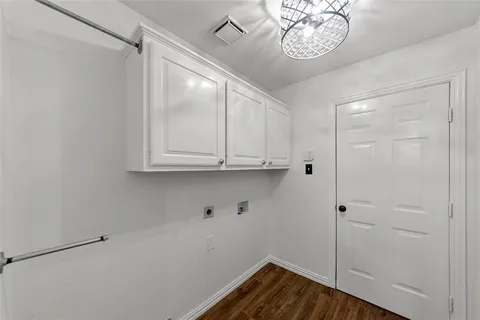 a view of room with wooden floor