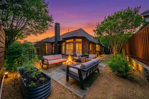 a backyard of a house with outdoor seating