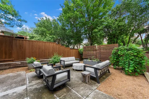 a backyard of a house with outdoor seating