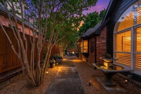 a view of a backyard with sitting area