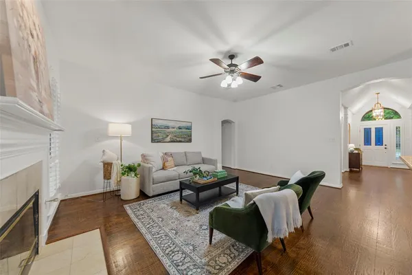 a living room with furniture and a fireplace
