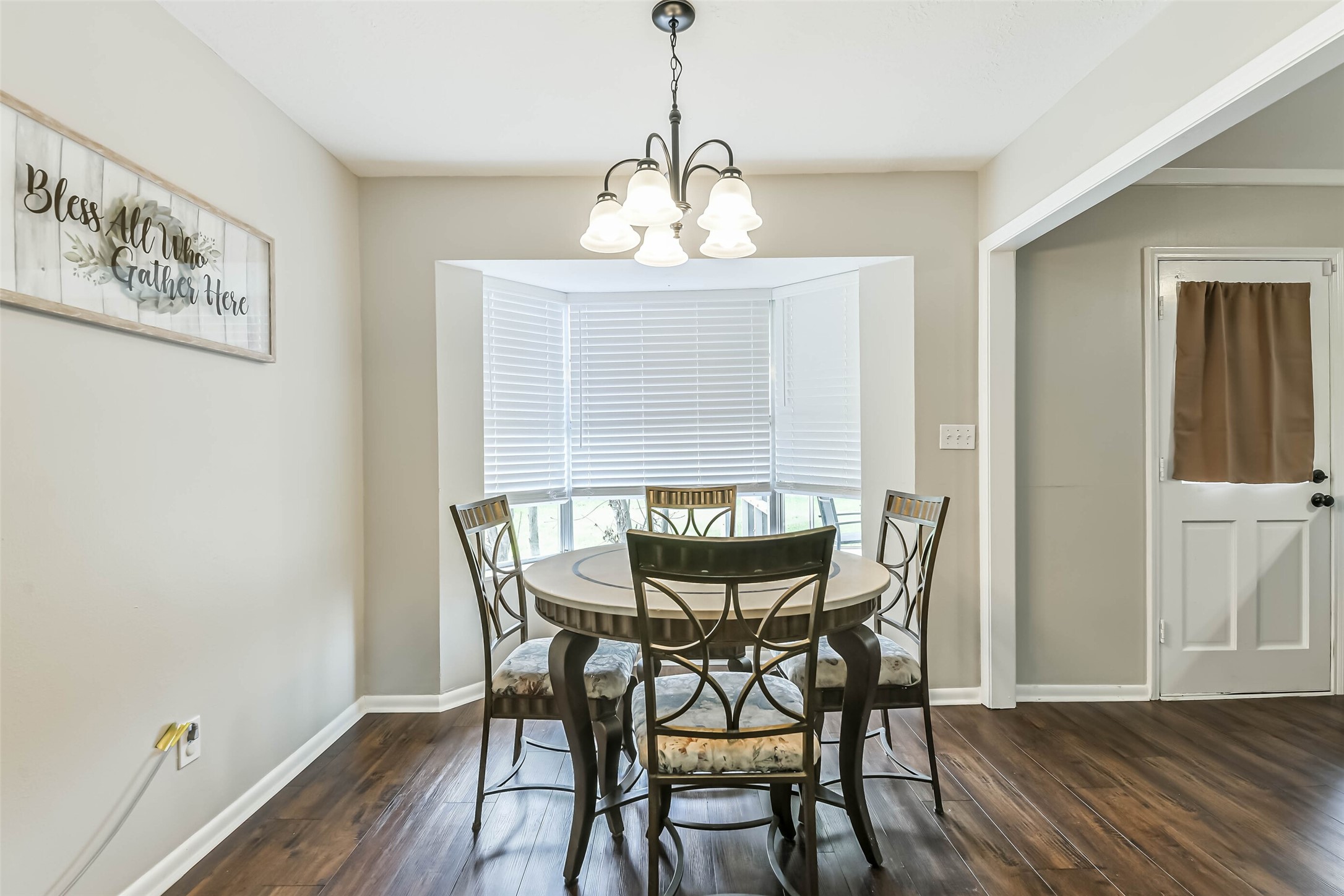 29319 Binefield Street Spring, TX 77386 - Photo 11 of 32 a view of a dining room with furniture window and wooden floor