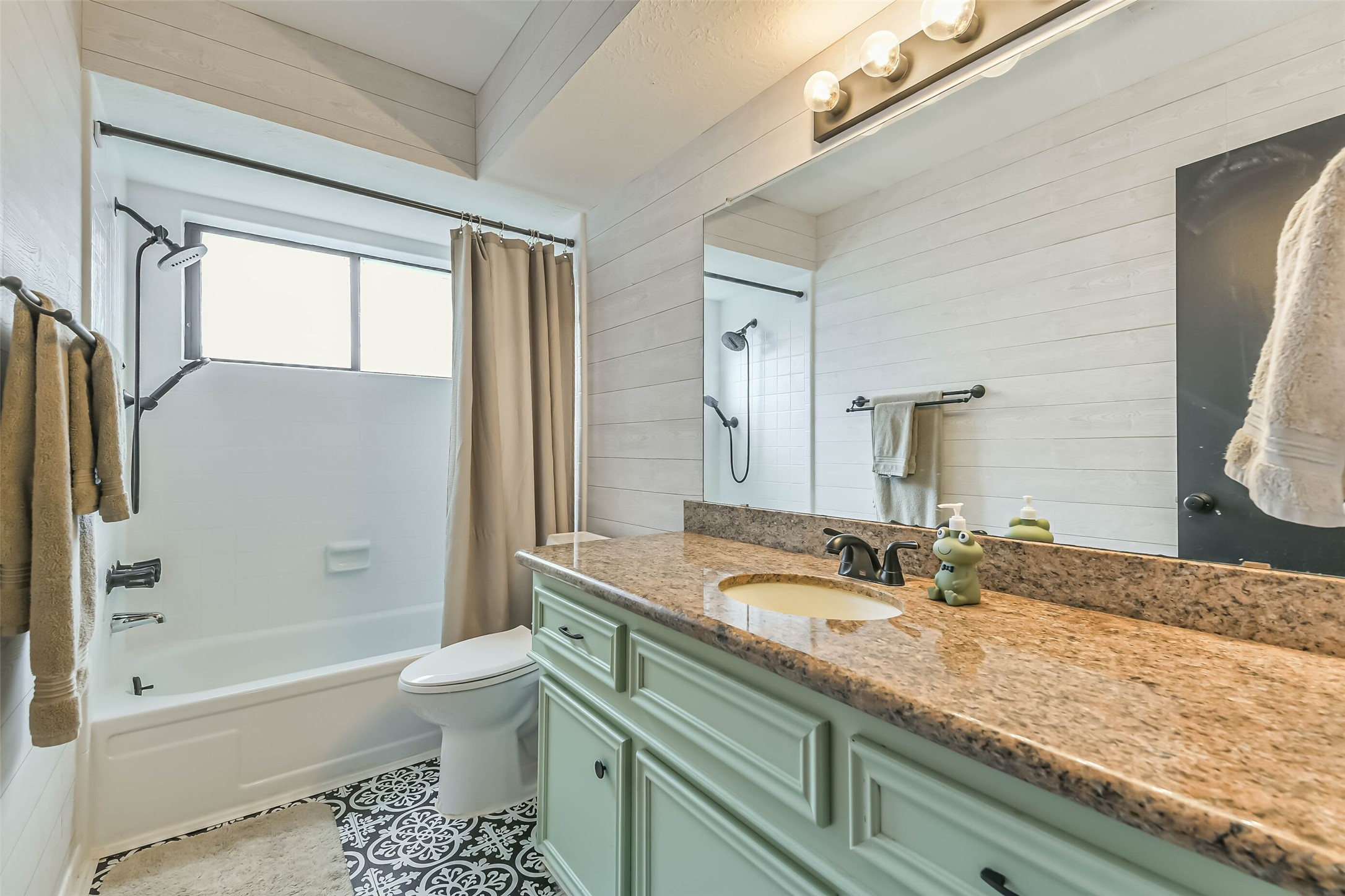 29319 Binefield Street Spring, TX 77386 - Photo 25 of 32 a bathroom with a granite countertop sink a toilet and bathtub