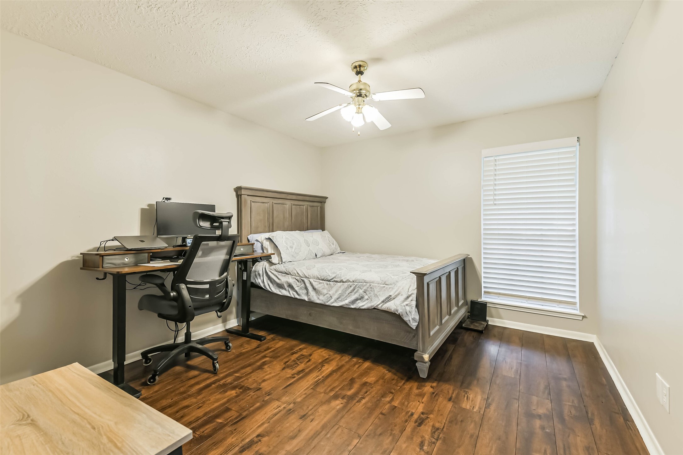 29319 Binefield Street Spring, TX 77386 - Photo 26 of 32 a bedroom with a bed and wooden floor