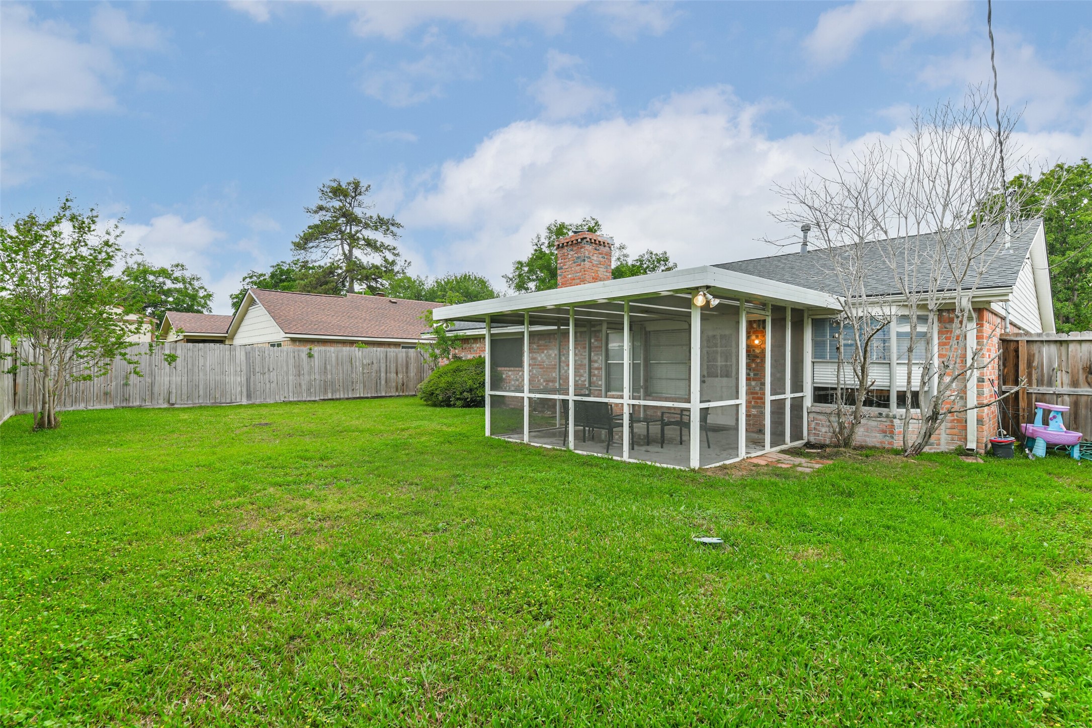 29319 Binefield Street Spring, TX 77386 - Photo 31 of 32 a view of a house with a backyard