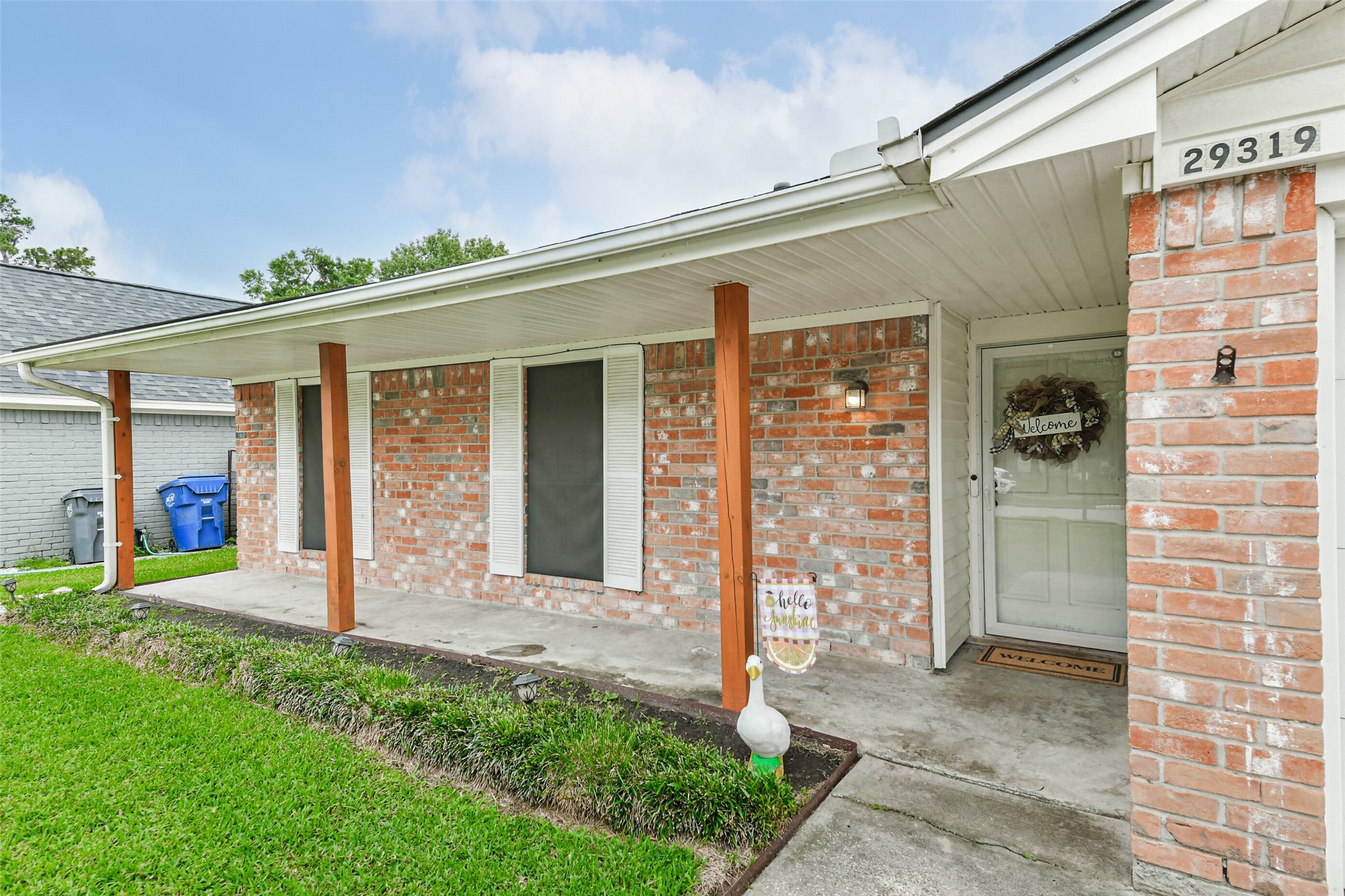 29319 Binefield Street Spring, TX 77386 - Photo 4 of 32 a front view of a house with a porch