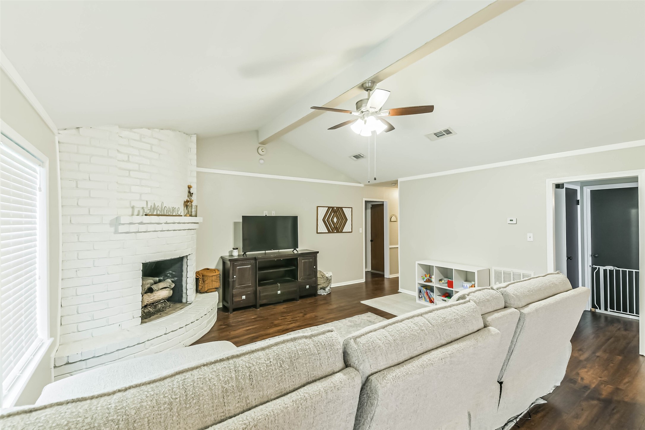 29319 Binefield Street Spring, TX 77386 - Photo 8 of 32 a living room with furniture and a fireplace