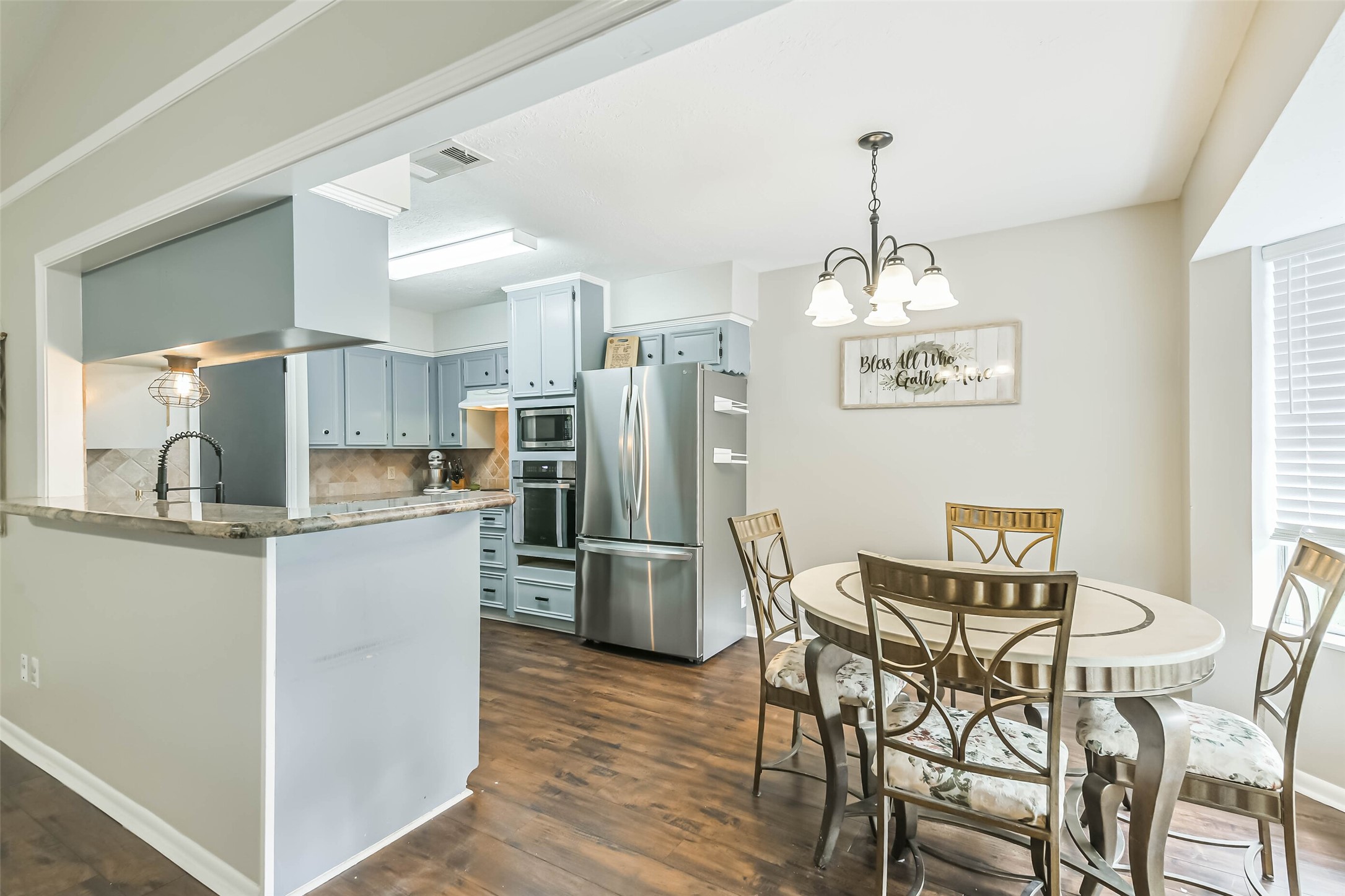 29319 Binefield Street Spring, TX 77386 - Photo 9 of 32 a kitchen with refrigerator and window