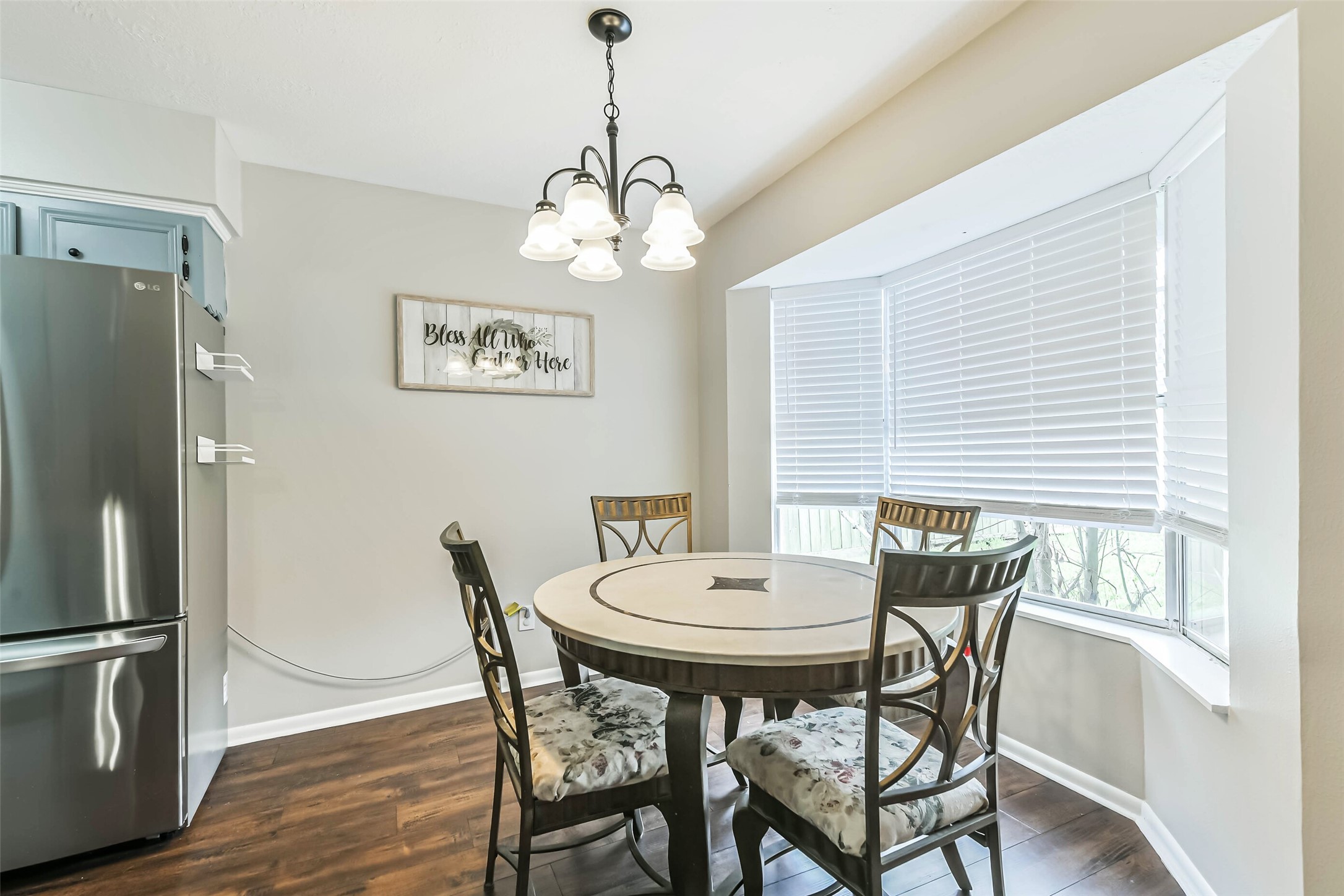 29319 Binefield Street Spring, TX 77386 - Photo 10 of 32 a view of a dining room with furniture window and wooden floor