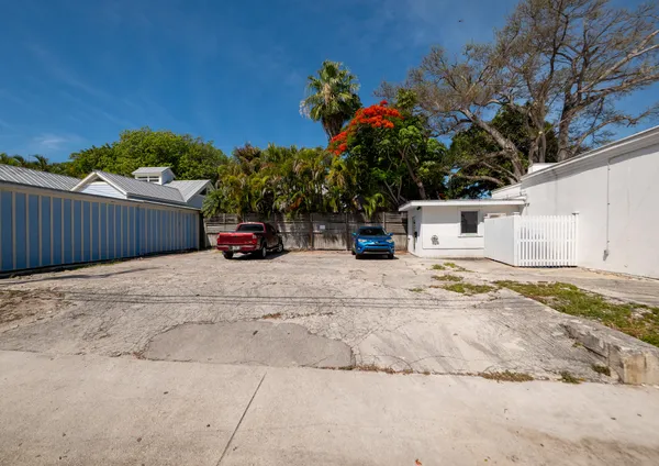 a view of a house with snow on the road