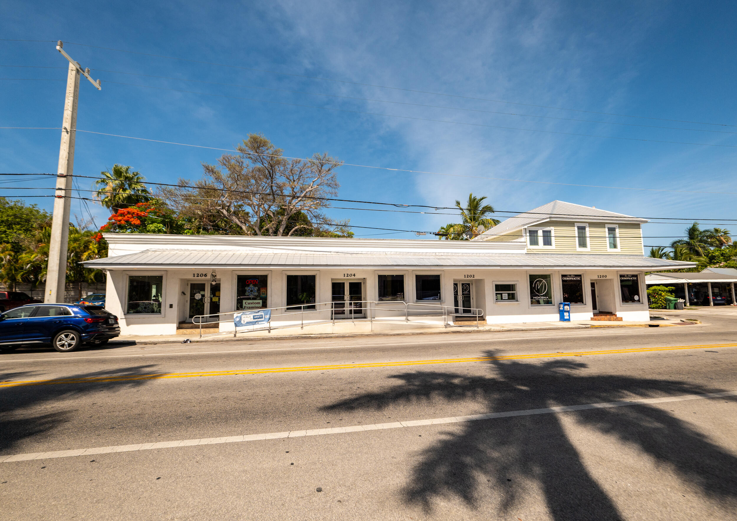 1124 Catherine Street, Unit 201 Key West, FL 33040 - Photo 18 of 21 a front view of a building with a street