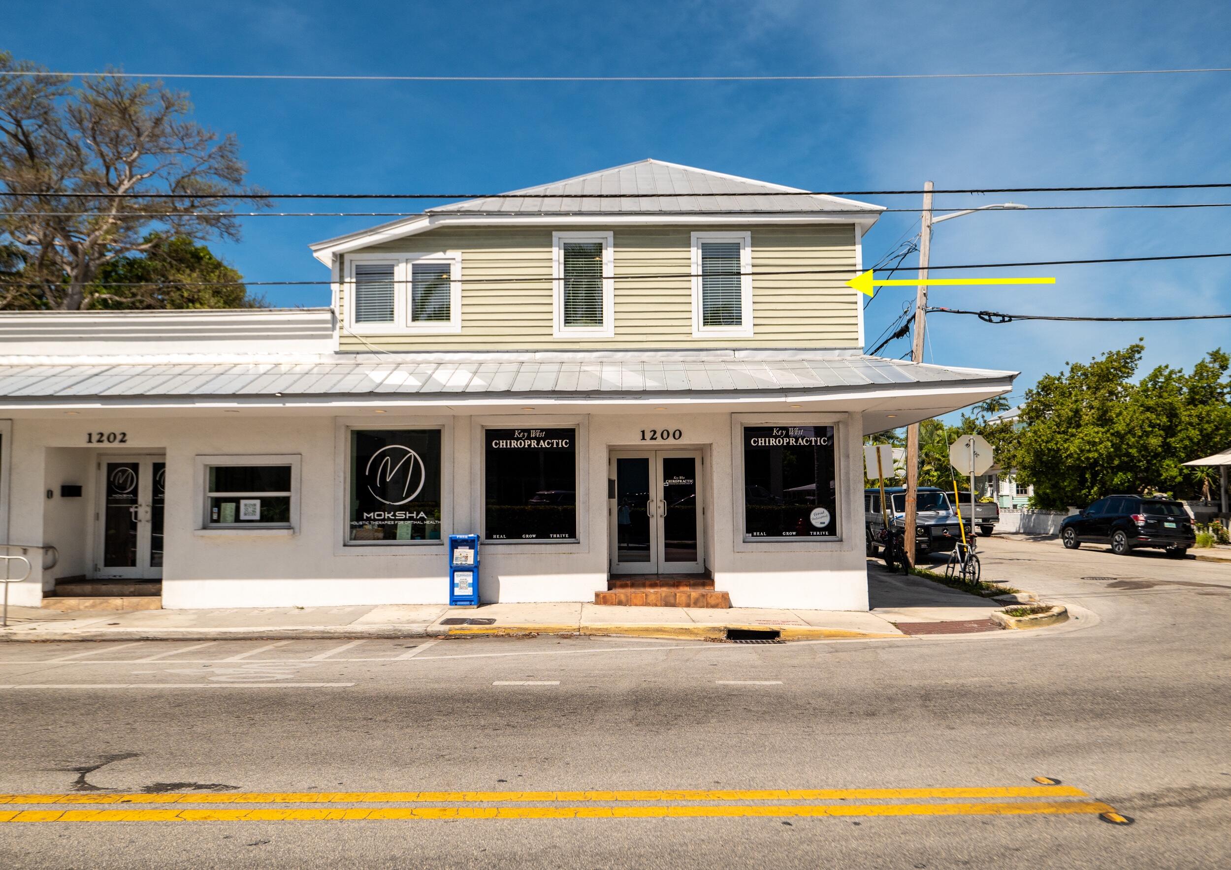 1124 Catherine Street, Unit 201 Key West, FL 33040 - Photo 3 of 21 a view of a building with street
