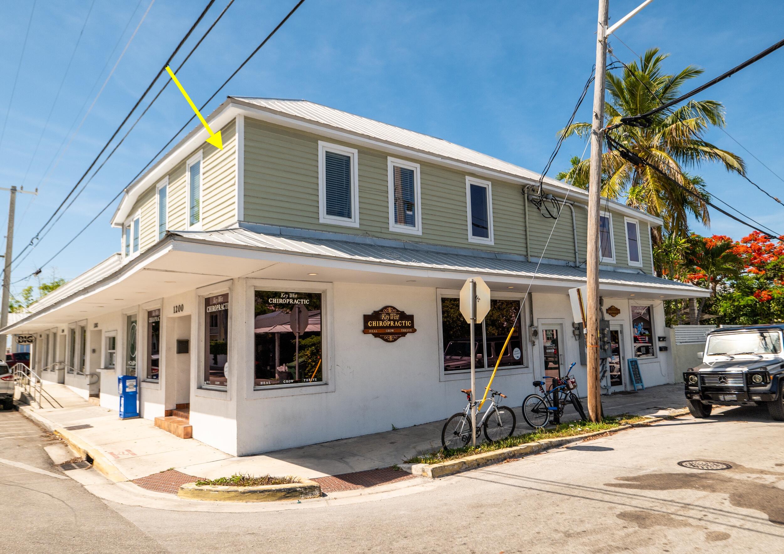 1124 Catherine Street, Unit 201 Key West, FL 33040 - Photo 4 of 21 a front view of a building with street view