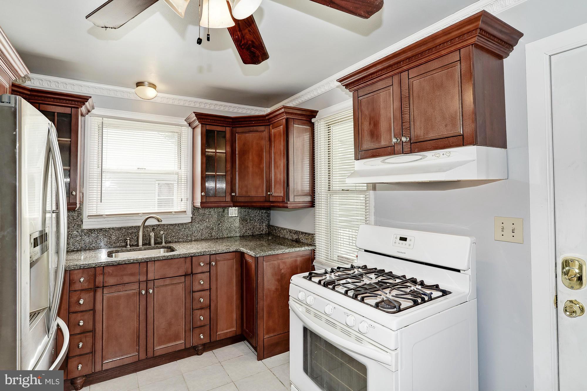 7925 Liberty Road Baltimore, MD 21244 - Photo 12 of 30 a kitchen with a stove and a sink